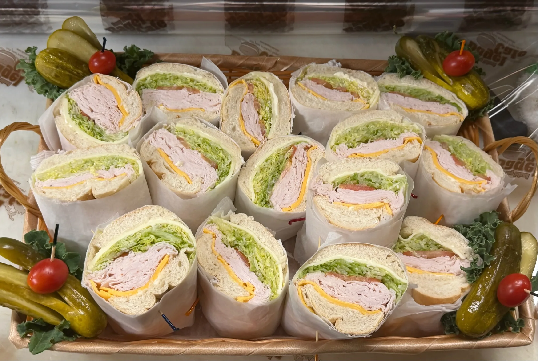 The American Party Hero — Boar's Head ham, turkey, roast beef, American and Swiss, lettuce, and tomato on a fresh hero