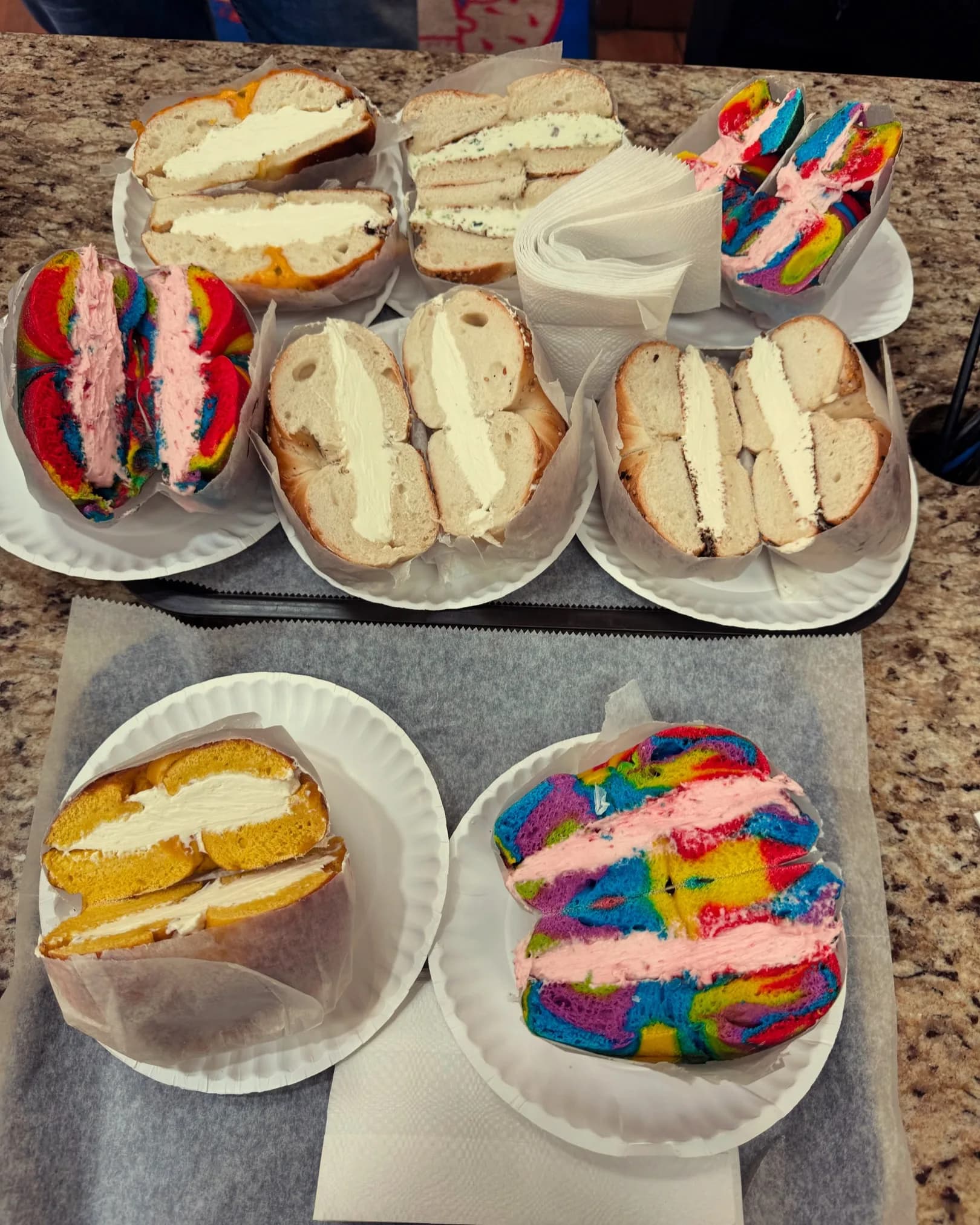 Bagels split and spread with our cream cheeses — built right at the counter