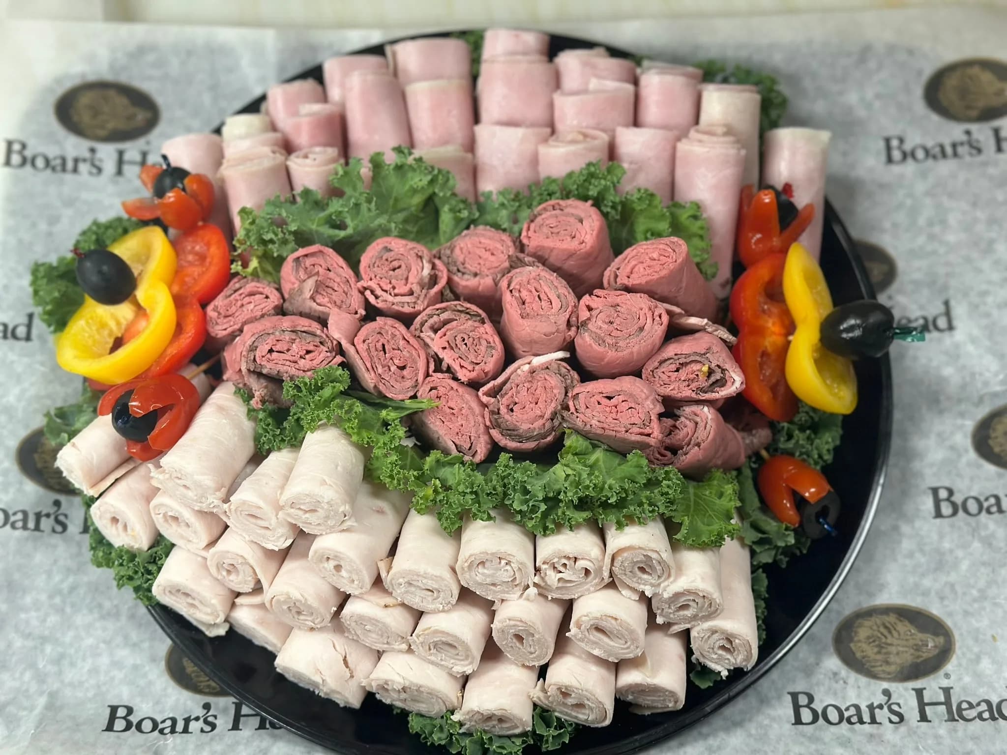 Boar’s Head Deli Platter — rolled ham, turkey, and roast beef with peppers and olives