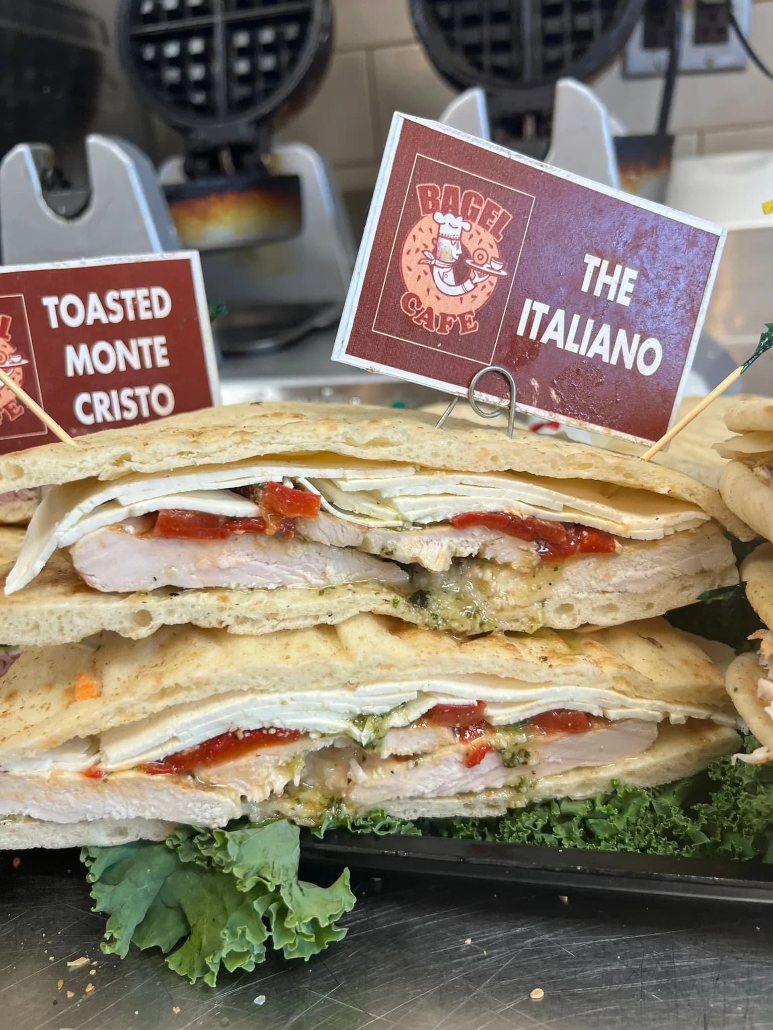 The Italiano panini, fresh off the press — grilled chicken, fresh mozzarella, roasted peppers, and pesto