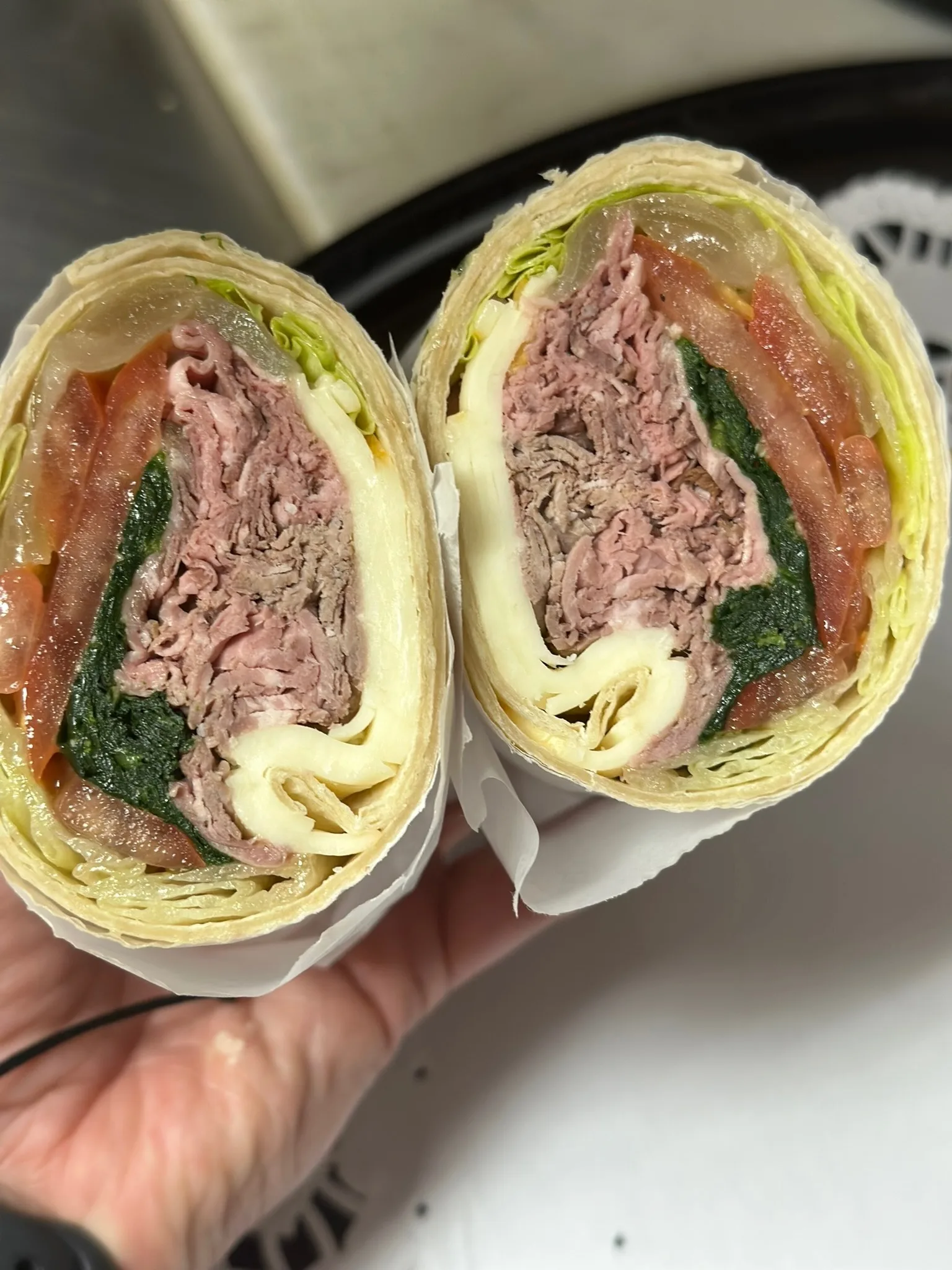 Roast Beef Lettuce Wrap — hand-sliced roast beef with Swiss, tomato, and fresh spinach