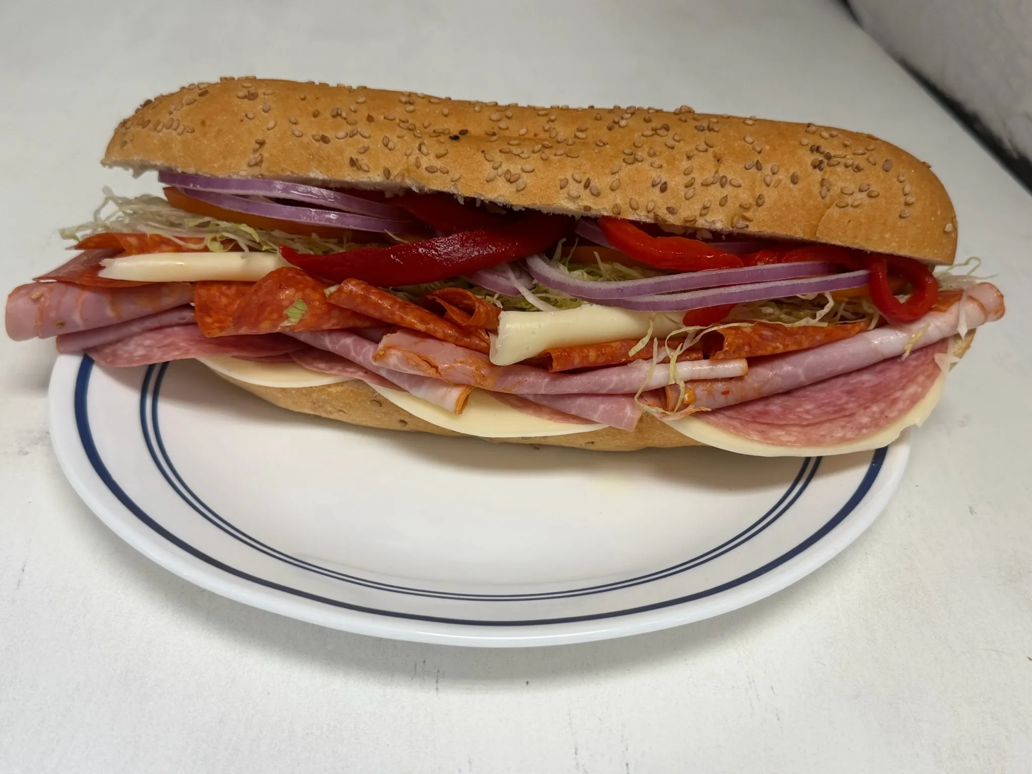 The Soprano — ham cappicola, salami, pepperoni, provolone, lettuce, tomato, and roasted peppers